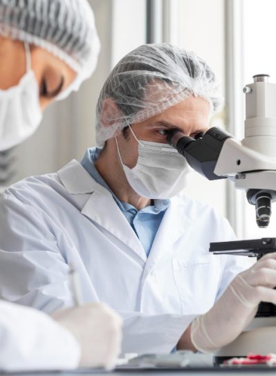 close-up-scientist-working-with-microscope